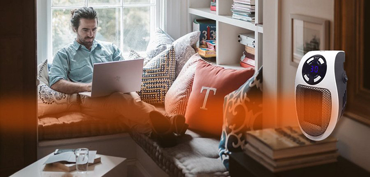 Top Heat in use in living room by man